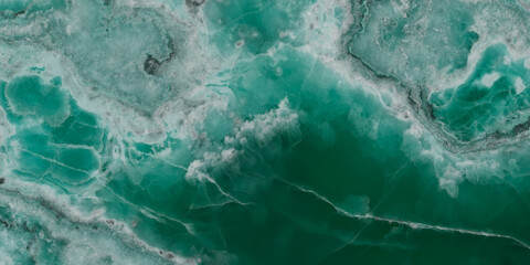 Elegant emerald green onyx marble texture with translucent layers and natural stone veins. © Vidal
