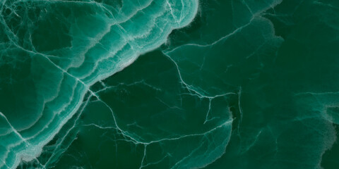 Elegant emerald green onyx marble texture with translucent layers and natural stone veins. © Vidal