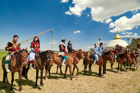 Mongolian performers on horseback at the Naadam Festival on the grasslands