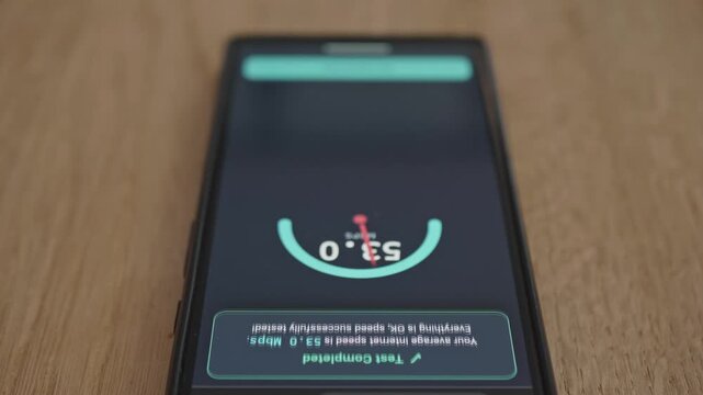 Digital UI on smartphone screen measuring data connection speed in megabits per second