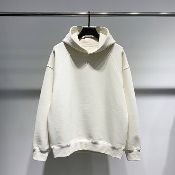 Cream sweatshirt on display at clothing store