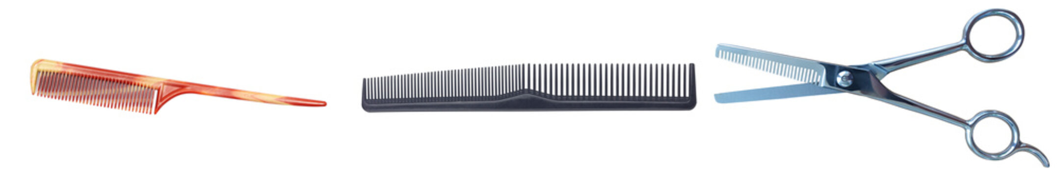 Two combs and a pair of scissors isolated on a white background