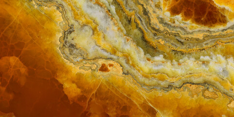 Elegant golden-yellow onyx marble texture featuring translucent layers and natural stone veining. © Vidal