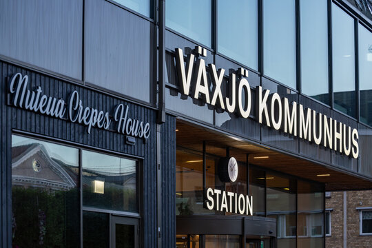 Vaxjo, Sweden  The exterior of the landmark Vaxjo Kommunhus at the Central Station and restaurant sign.