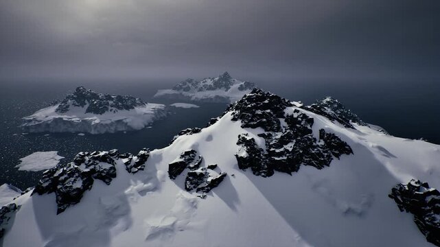 Climbers photographing towering summit. High altitude view capturing challenging mountain adventure. Snowcapped peak with rugged terrain and sweeping sky view