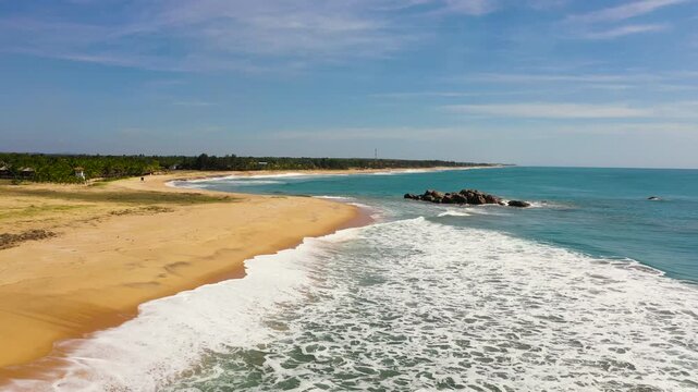 Top view of a beautiful sandy beach and ocean with waves. Whiskey point, Sri Lanka.