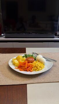 Delicious vegetable salad on white plate