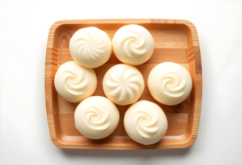 Fototapeta premium Top view of seven white mochi desserts on wooden tray