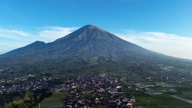Aerial drone footage showcasing the majestic landscape of Mount Sumbing, an active stratovolcano and the second-highest volcano in Central Java, Indonesia.