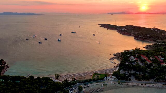 Panoramic aerial view of the popular Astir Beach at Vouliagmeni, south Athens coast, Greece, during a beautiful summer sunset