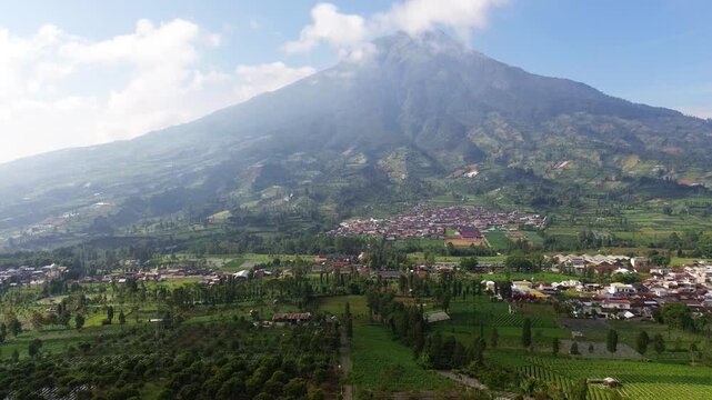 Aerial drone footage showcasing the majestic landscape of Mount Sumbing, an active stratovolcano and the second-highest volcano in Central Java, Indonesia.