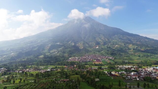 Aerial drone footage showcasing the majestic landscape of Mount Sumbing, an active stratovolcano and the second-highest volcano in Central Java, Indonesia.