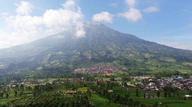Aerial drone footage showcasing the majestic landscape of Mount Sumbing, an active stratovolcano and the second-highest volcano in Central Java, Indonesia.