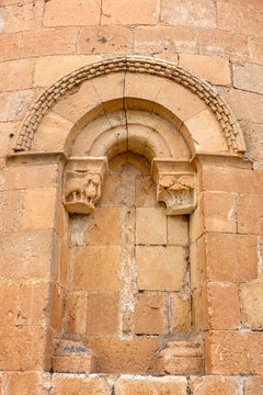 Detail of the 12th-century Romanesque blocked apse window with checkerboard molding archivolt and carved capitals at the Church of the Nativity of Our Lady in Sotillo, Segovia, Castile and Le&oacute;n, Spain