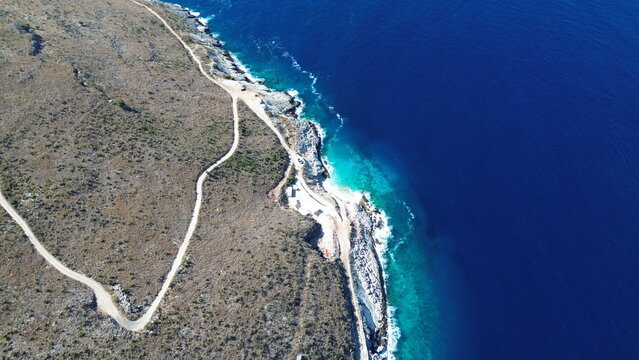 Aerial view of the turquoise sea and historic Porto Palermo peninsula, Albania