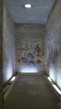Sacred corridor inside the Abydos Temple illuminated by natural light, revealing detailed carvings and timeless Egyptian heritage. Egypt