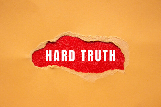 Revealing hard truth message appearing on red background through a torn beige paper, symbolizing honesty and disclosure