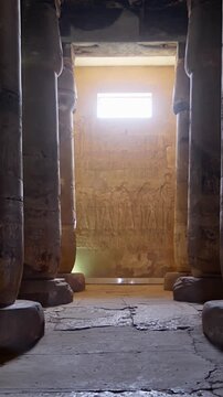 Ancient Egyptian temple corridor at the Abydos Temple with richly detailed hieroglyphs and impressive stone architecture. Egypt