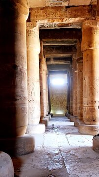 Ancient Egyptian temple corridor at the Abydos Temple with richly detailed hieroglyphs and impressive stone architecture. Egypt