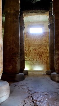 Timeless architectural scene inside the Abydos Temple with towering pillars and historic carvings, reflecting ancient spirituality. Egypt