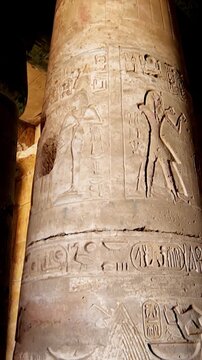 Timeless architectural scene inside the Abydos Temple with towering pillars and historic carvings, reflecting ancient spirituality. Egypt