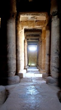 Timeless architectural scene inside the Abydos Temple with towering pillars and historic carvings, reflecting ancient spirituality. Egypt