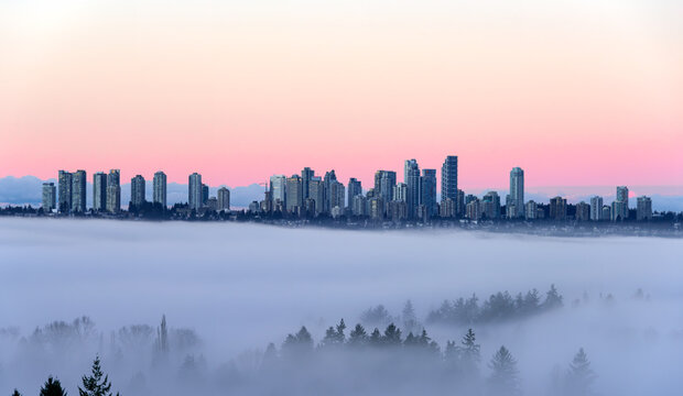 Metrotown Cityscape with Skyscrapers Flying in the Sky. Rising Above a Dense Low Fog