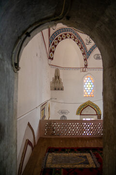 MOSTAR, BOSNIA AND HERZEGOVINA - JUNE 26, 2022: Interior architectural view of the historic 17th-century Koski Mehmed Pasha Mosque, featuring the traditional decorated mihrab niche