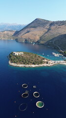 Obraz premium Cinematic aerial view of the historic Ali Pasha Castle on Porto Palermo peninsula surrounded by the Mediterranean Sea, Albania