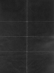 Fototapeta premium Abstract dark charcoal paper texture with subtle grid lines and vintage grain