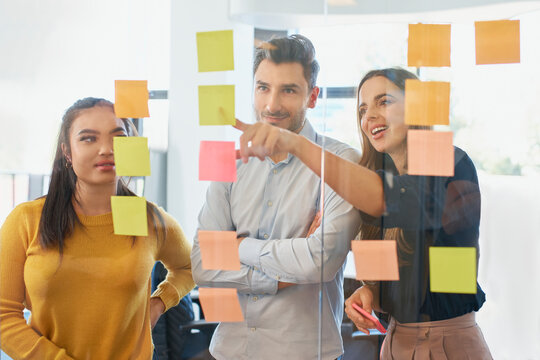 Businesswoman conducting brainstorming session with colleagues at office