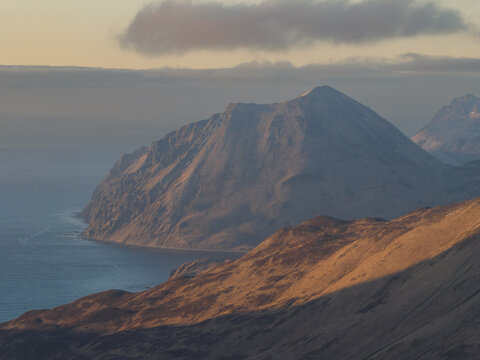 Aerial view of the rugged mountains and coastline of Unalaska, Alaska, United States.