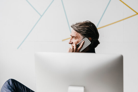 Mature businessman on cell phone
