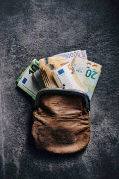 Studio shot of purse filled with money