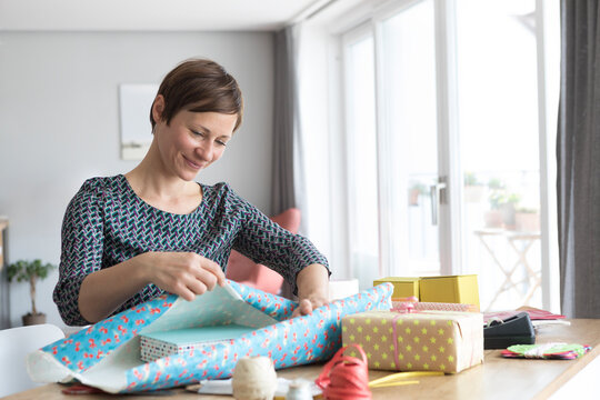 Woman wrapping gifts