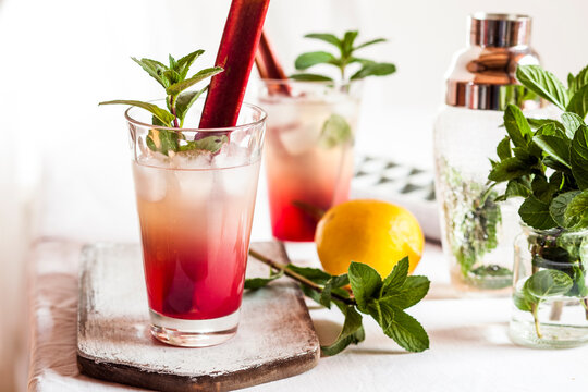 Rhubarb Collins with gin, prosecco, lemon juice, rhubarb juice and hibiscus syrup