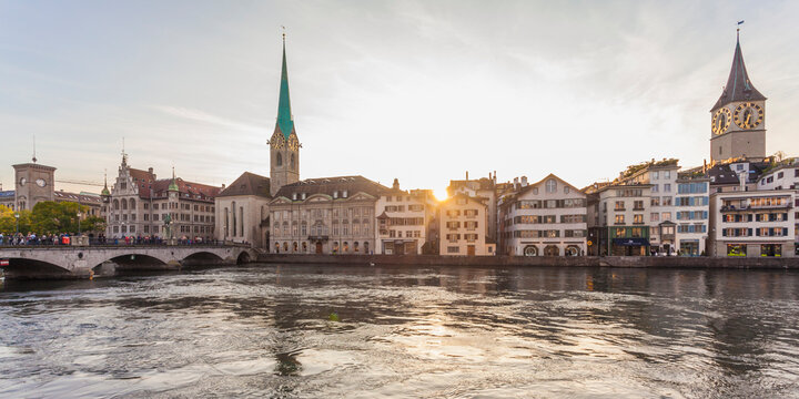 Switzerland, Zurich, River Limmat, Fraumuenster Church and St. Peter Church, Panorama in the evening
