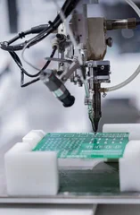 Electronic circuit board soldering machine, PCB soldering machine assembly chip components on pcb board inside at industrial © Photo Gallery