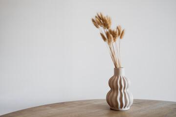 Scandinavian Style Vase with Dried Wheat in Minimalist Beige Interior © Iana
