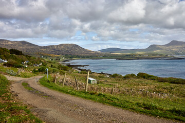 From the road to Maol Buidhe looking North East across Kilchoan Bay  and Port Mor to Kilchoan with Glas Bheinn and other hills in the background. Argyll and Bute, Scotland, UK © Fencewood studio