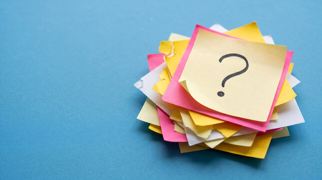 A large stack of colorful sticky notes featuring a hand drawn black question mark symbol top