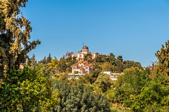 A view towards the Hill of the Nymphs in Athens, Greece in early summertime