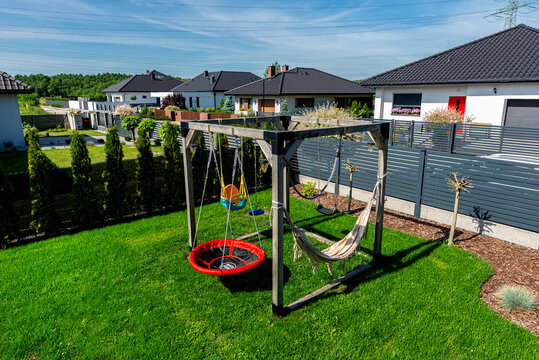 Backyard with playground, swing set, and hammock