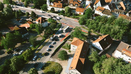 Fototapeta premium Aerial view of suburban street with cars and houses