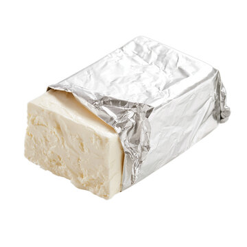 Rectangular block of cream cheese partially exposed from plain silver foil wrapping. Isolated white background. Png format