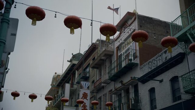 Red Lanterns Strung Over Chinatown Street In San Francisco City - Low Angle