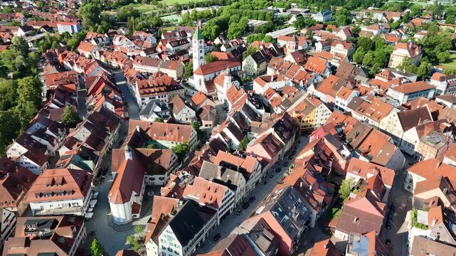 Marktplatz in Wangen im Allgau, Smooth cinematic drone shot gliding over the central market square, red roofs and historic Blaserturm tower.