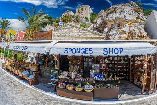 SYMI, GREECE - JULY 3, 2022: Sponge and souvenirs shop. The island is famous for medicinal sponges brought from the deep.