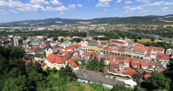 4k panning left motion high angle panoramic view of the city of Trencin, view taken from the Trencin Castle with Peace Square in foreground which is the historic heart of the city, Trencin, Slovakia