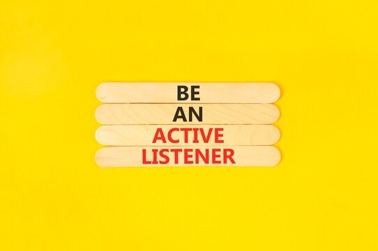 Be an active listener words symbol. Concept words Be an active listener on beautiful wooden sticks. Beautiful yellow background. Business be an active listener concept. Copy space.